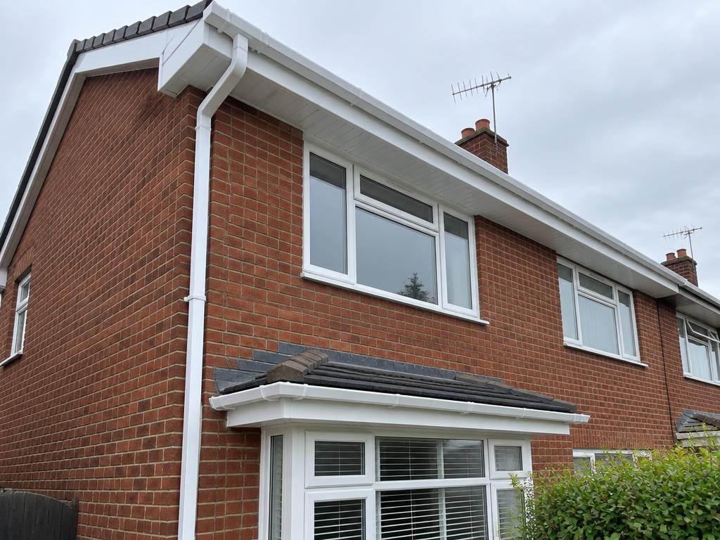 Home with white guttering, fascias and soffits